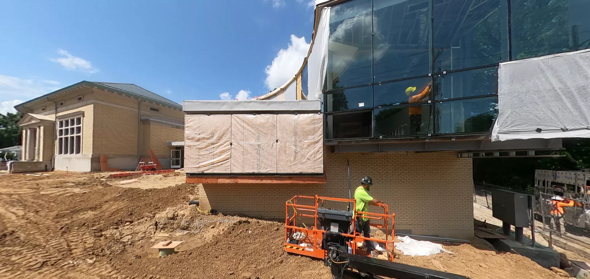 Construction workers working on exterior of building