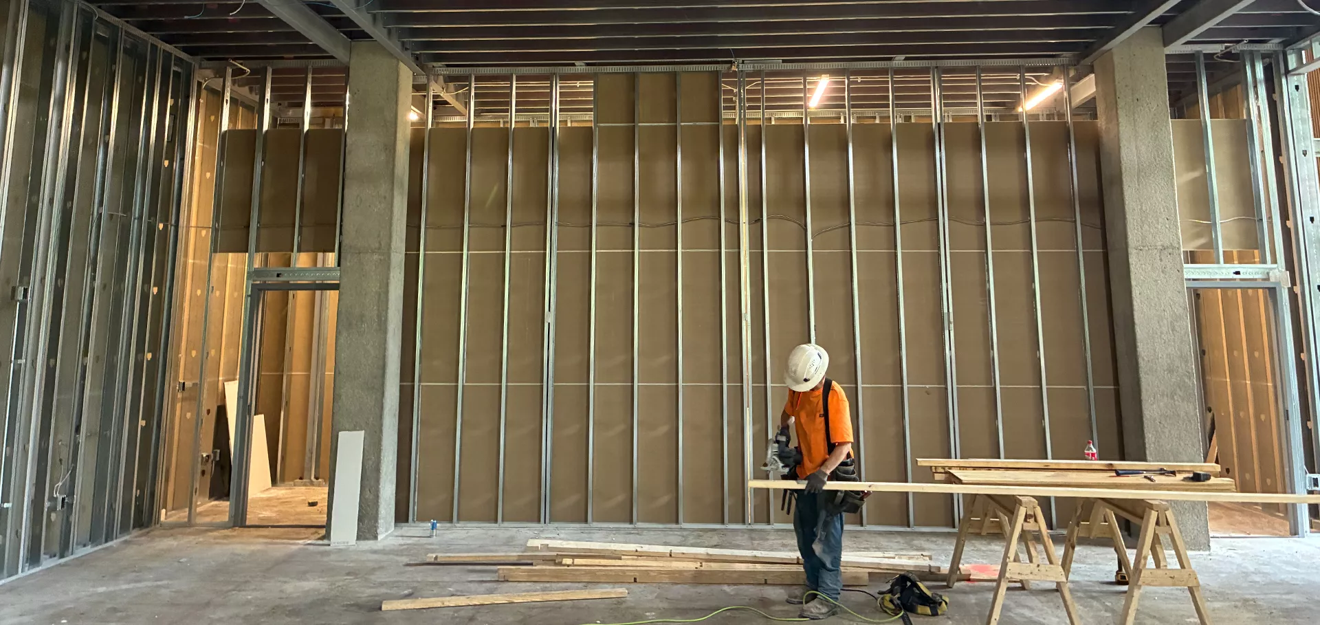Construction worker cutting boards